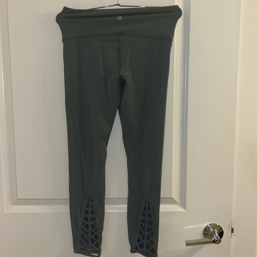 Gorgeous olive green leggings , never worn before .